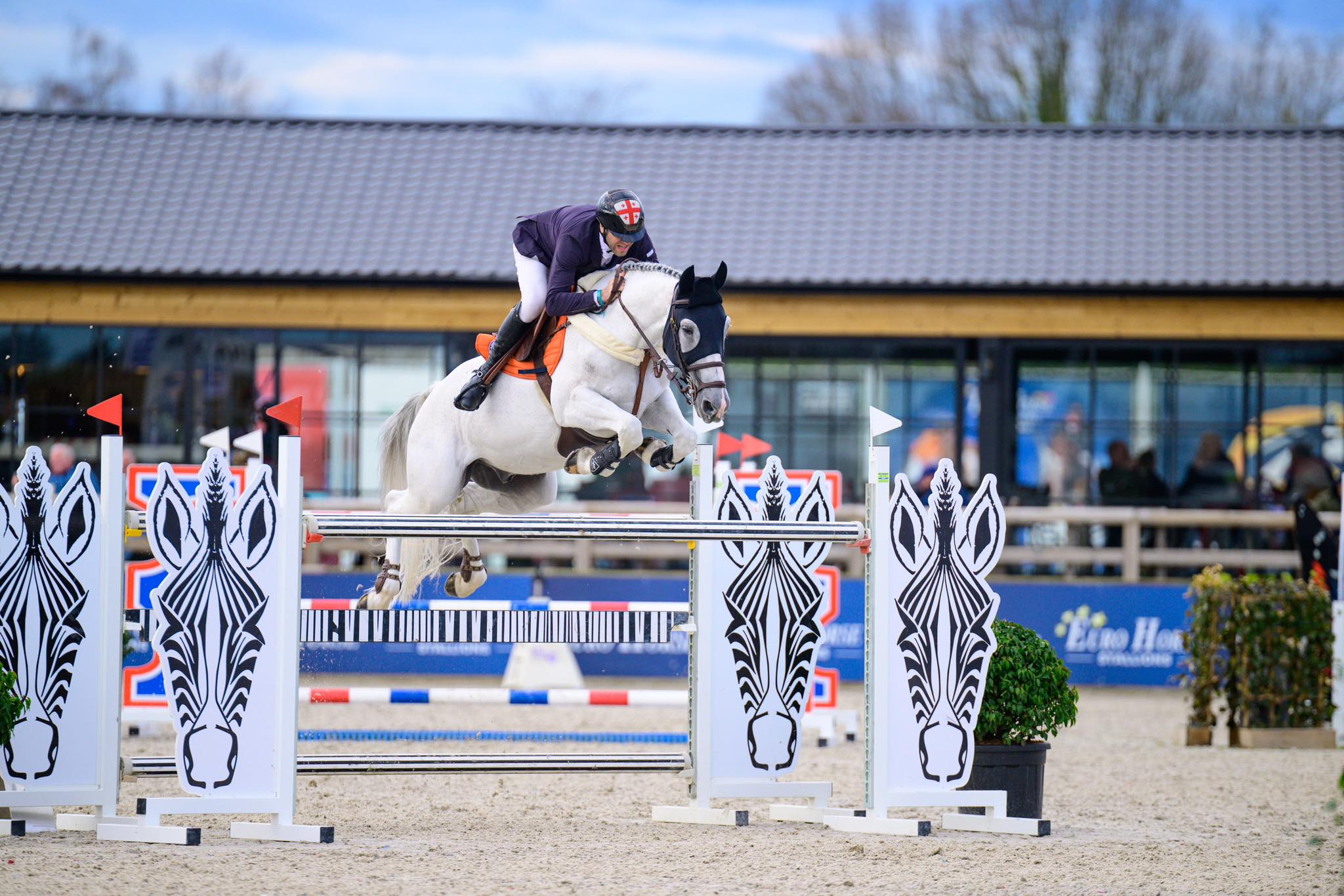 Rider jumping horse